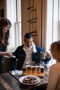 A couple being served at Lock St. Brewing Co.